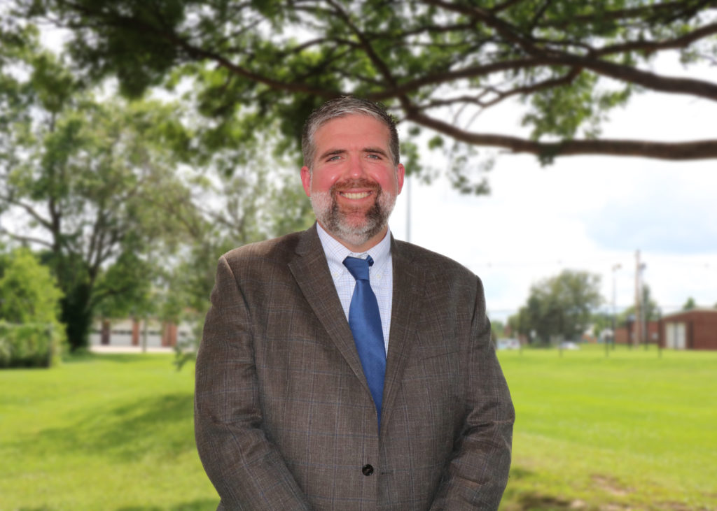 John Eveland stands outside the Board of Education Office