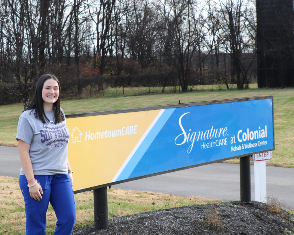Kameron Ferriell stands outside Signature HealthCARE at Colonial Rehab and Wellness Center