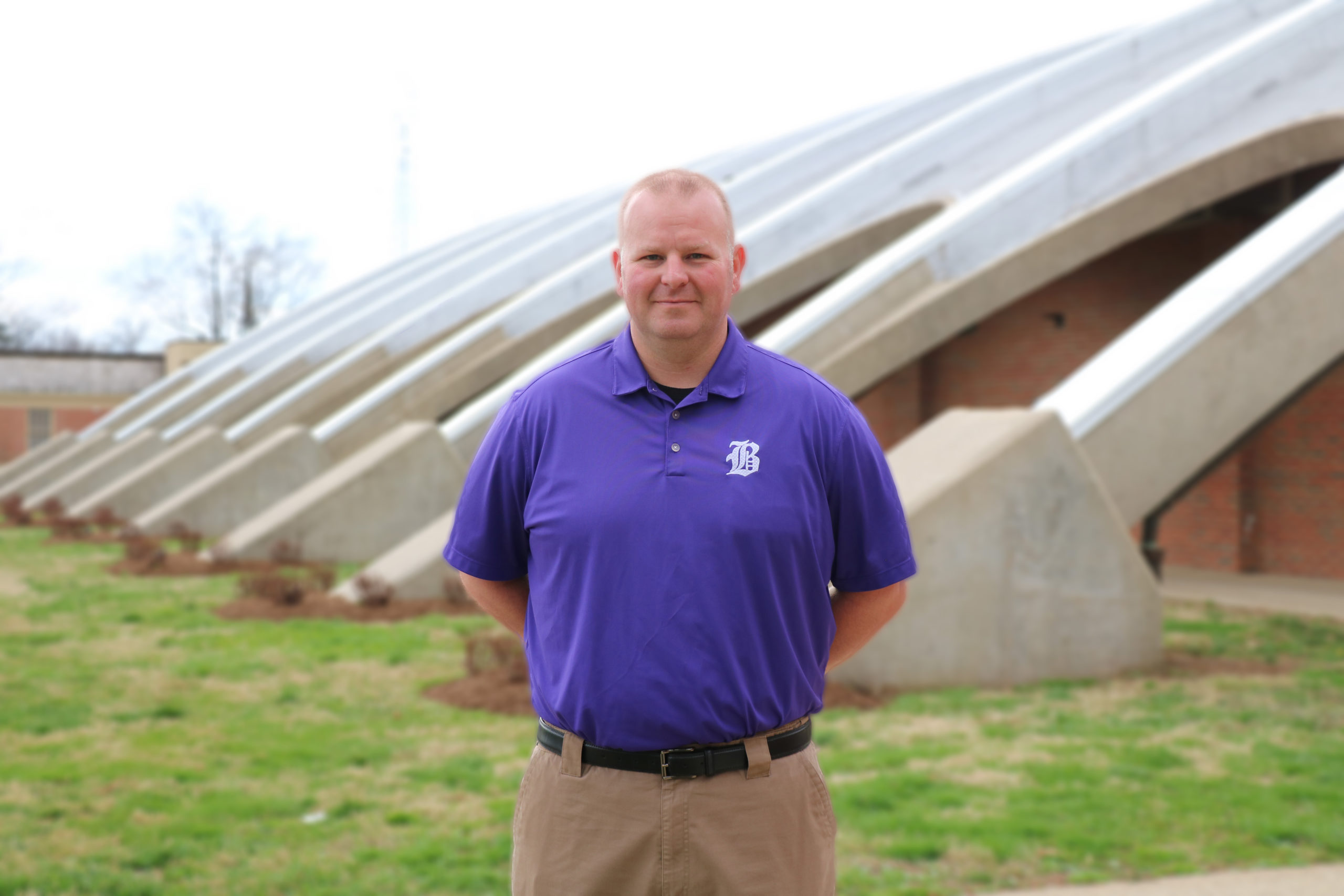 Andrew Riley stands in front of the Bardstown High School gymnasium