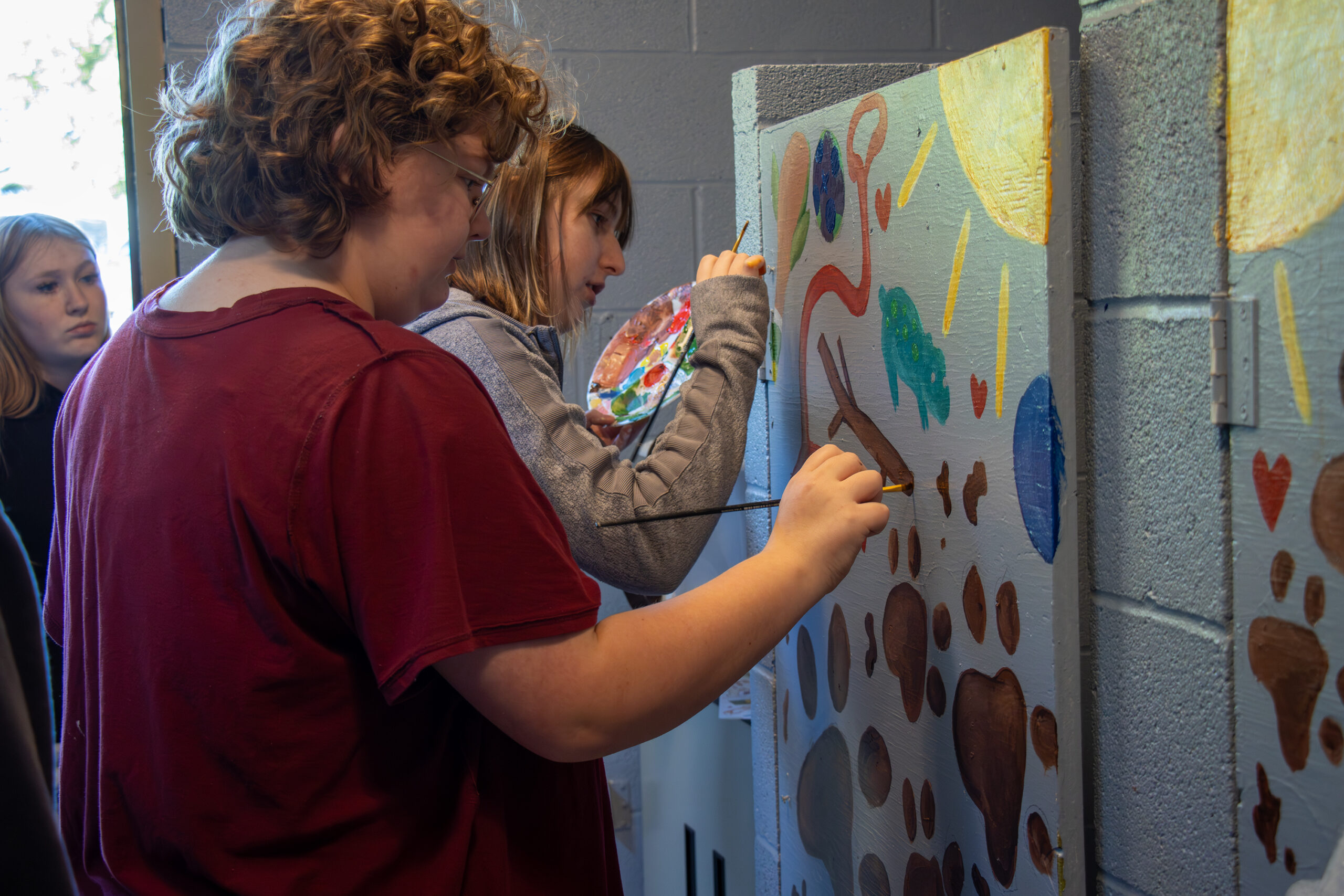 Delia Ramey and Jazmine Kruzich painting.