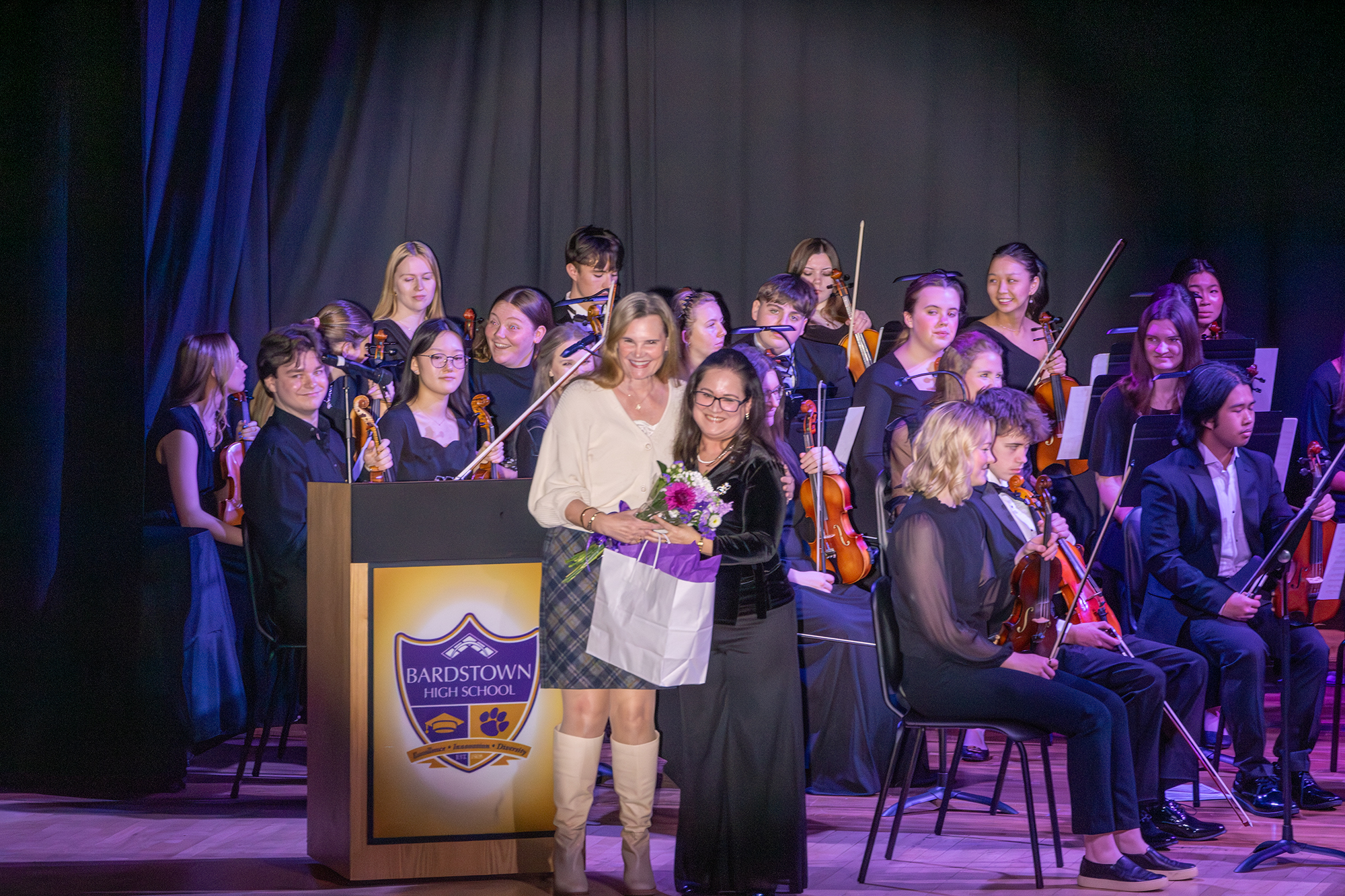 Mrs. Paola Land recognizes Mrs. Ellen Baker Finn's critical role in launching the strings program.