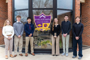 Six Bardstown High School juniors stand together smiling for a group photo after being selected for the Governor’s Scholars Program: Derrick Greenwell, Katy Floyd, Mason Schat, Naru Sugie, Mackenna Smith, and Will Thomas.