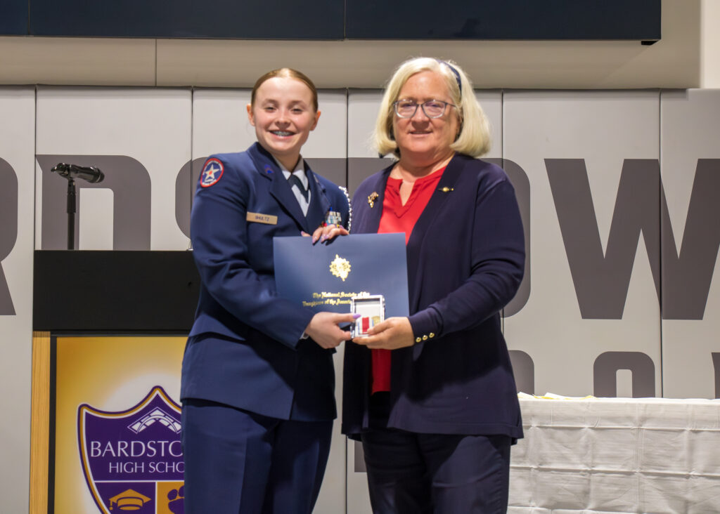 Gabbi Shultz accepting an award 