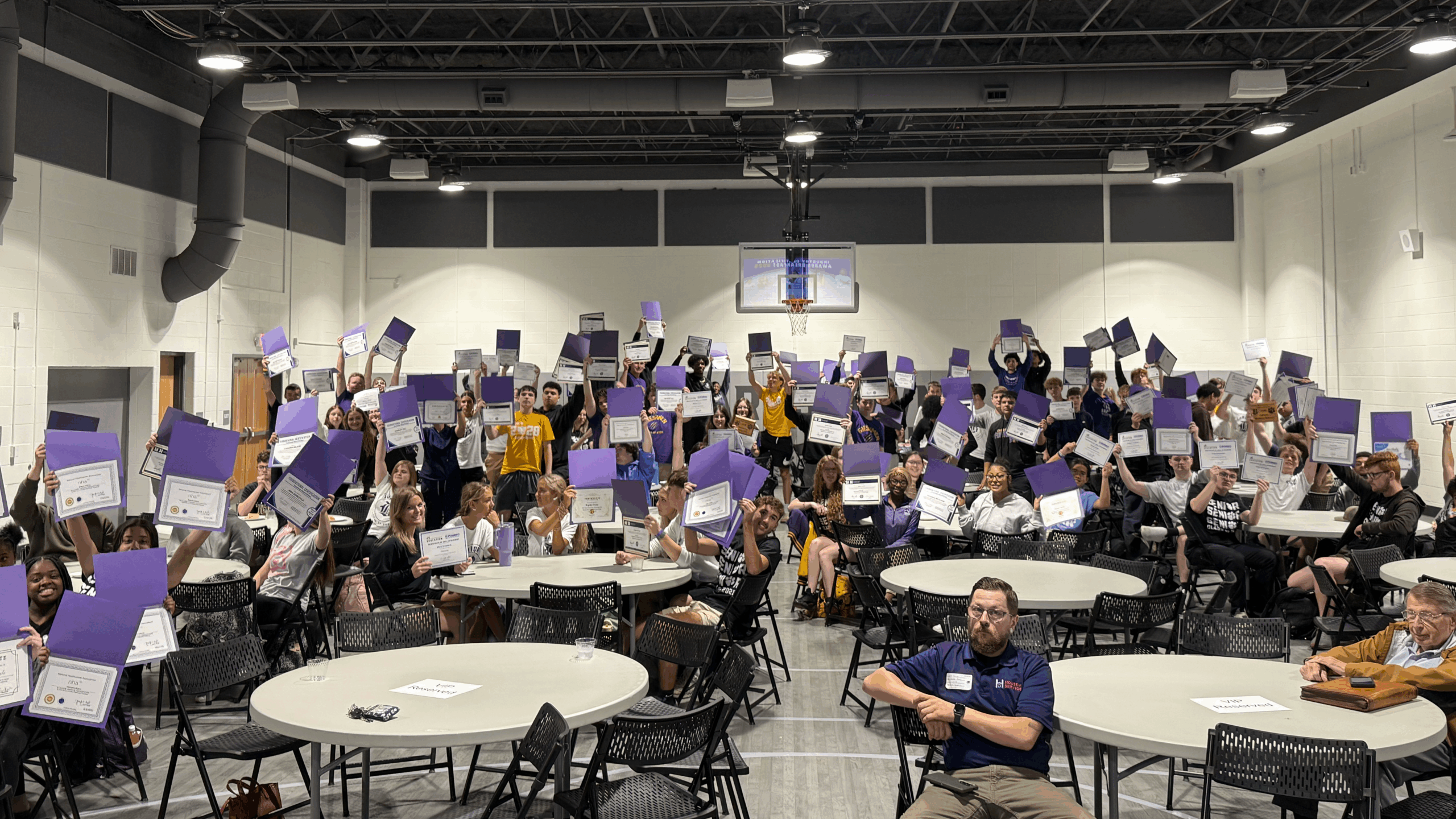 group with purple folders